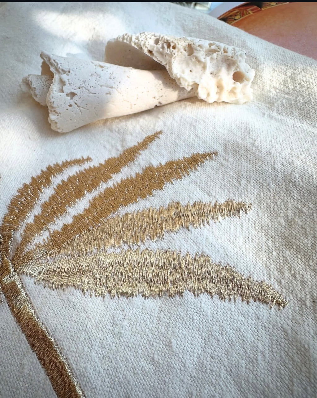 Gold palm tree hand embroidery close-up on white linen bag — Souhaib Creative Service
